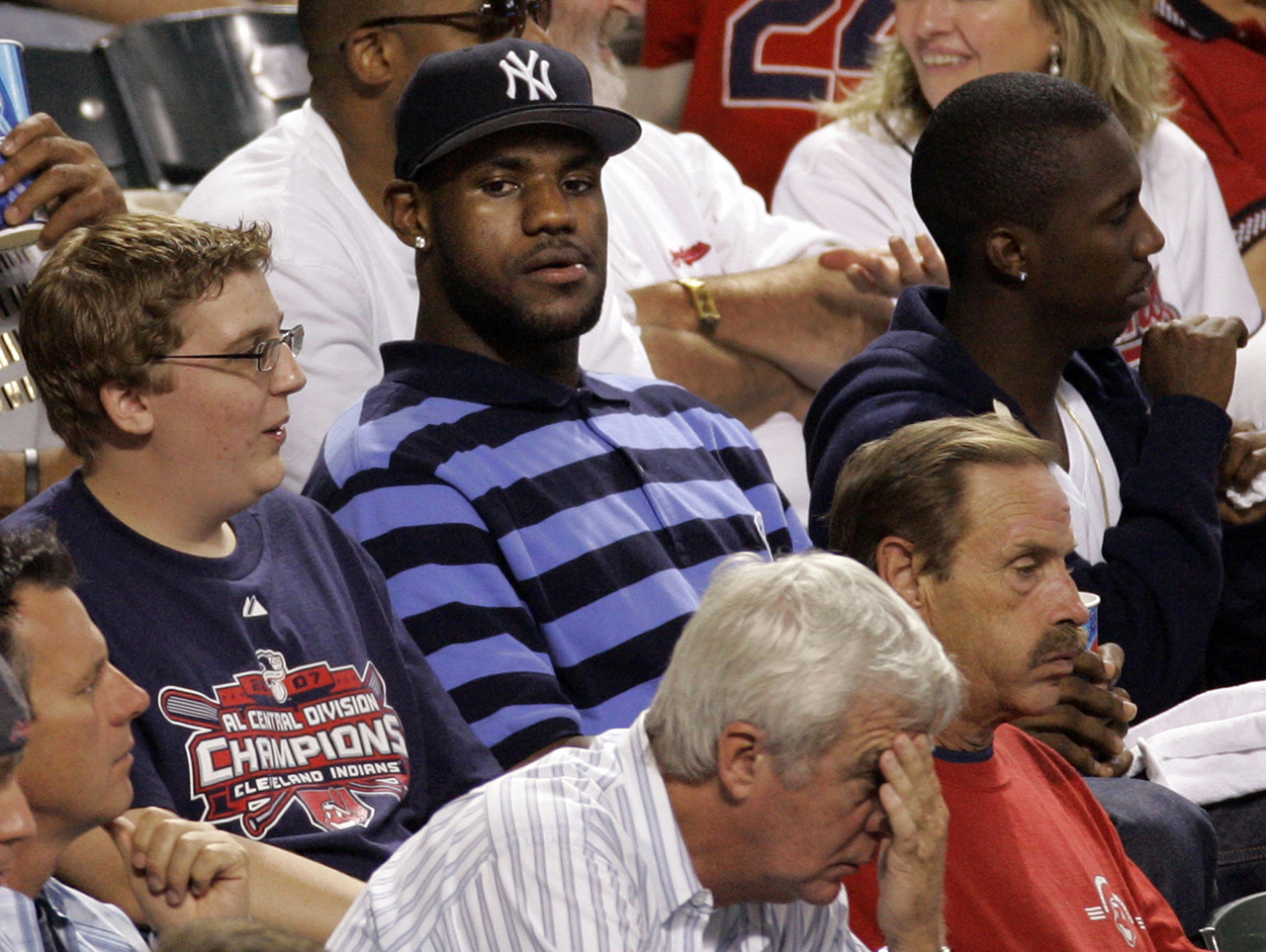Cleveland Cavaliers LeBron James, wearing a New York Yankees hat, watches  Game 1 of an American League Division Series baseball game between the Yankees and Cleveland Indians Thursday, Oct. 4, 2007, in Cleveland. (AP Photo/Amy Sancetta)